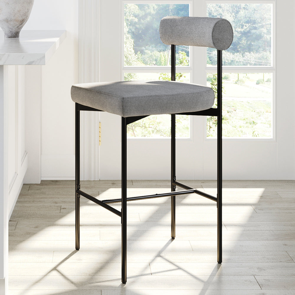 Gray upholstered bar stool with a cylindrical backrest and a black metal frame.
