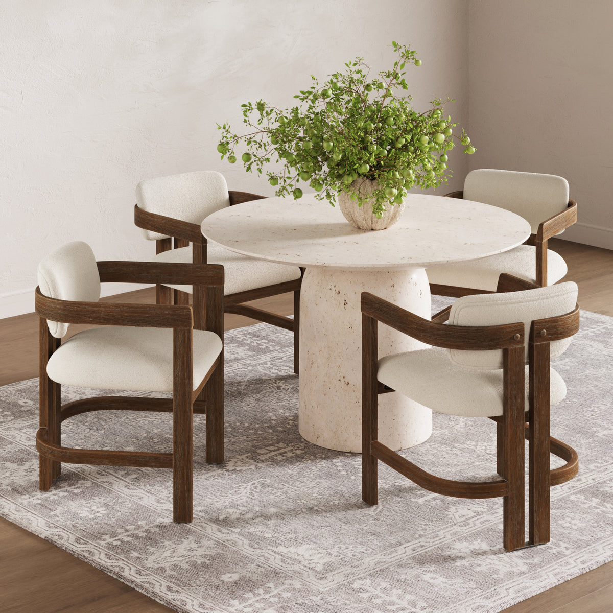 Four Nathan James Modern Boucle Wood Dining Chairs with curved backs and cream seats around a round stone table.
