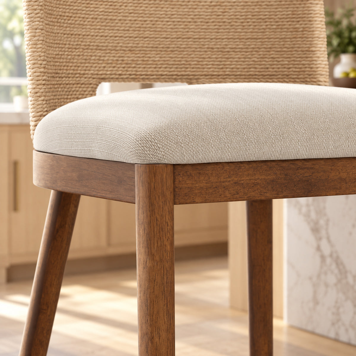 A dining chair with a woven backrest, light-colored upholstered seat, and dark wood frame.