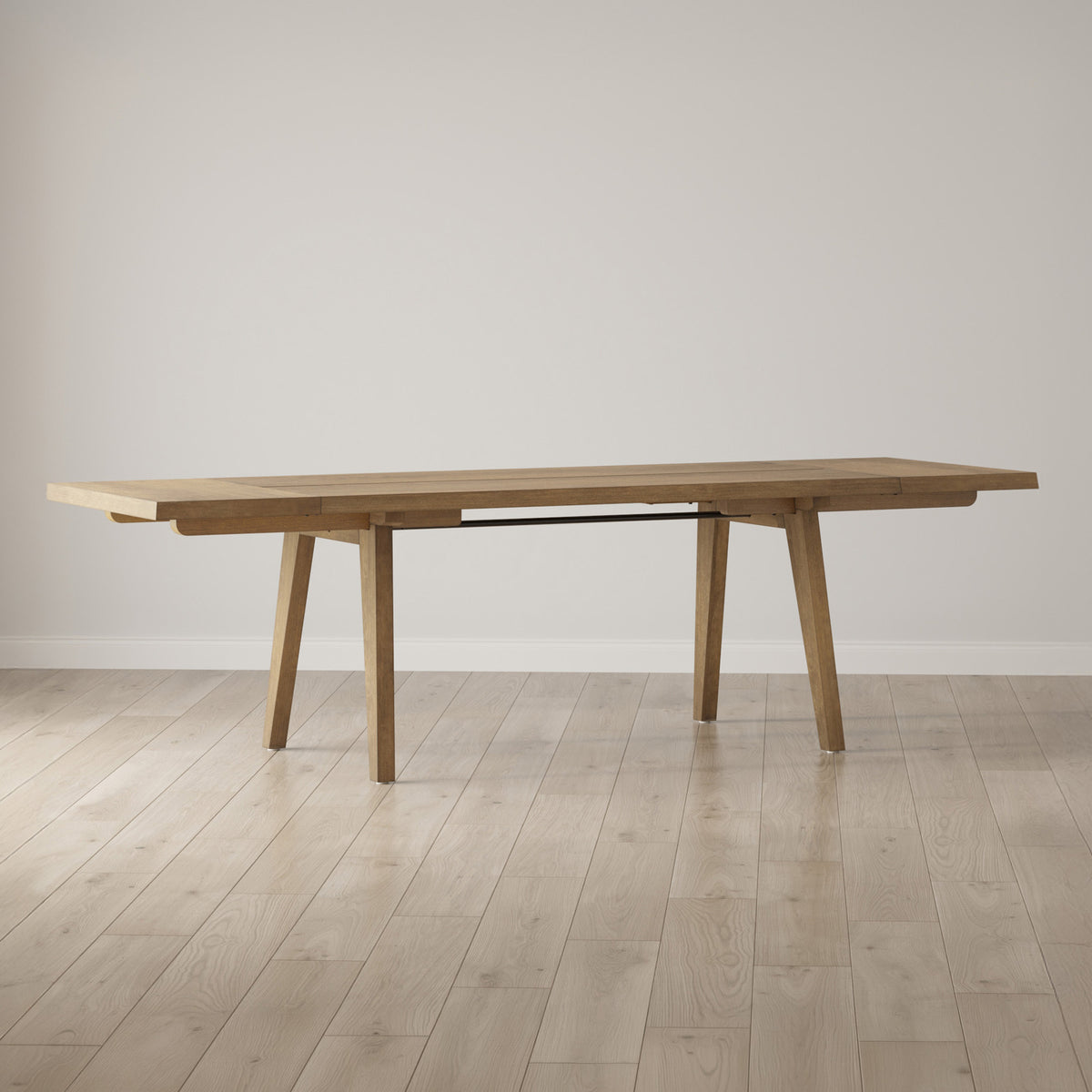 A light wood dining table with angled legs.