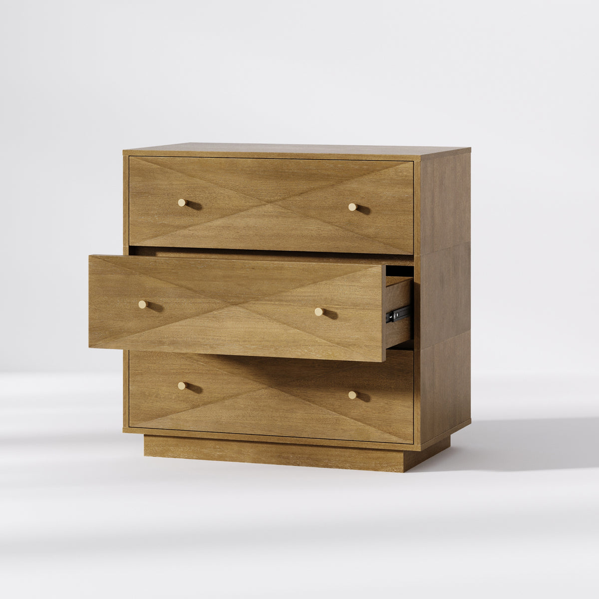 Three-drawer wooden dresser with geometric drawer-front patterns and circular knobs, featuring the middle drawer pulled open.