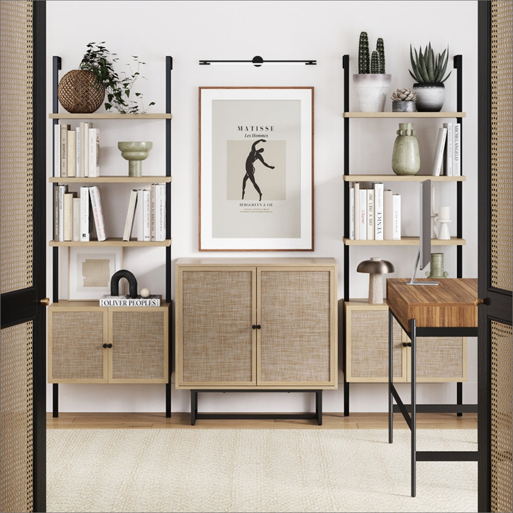 A home office featuring two tall shelving units flanking a central cabinet, a Matisse wall print, and a wooden desk, viewed through a doorway.