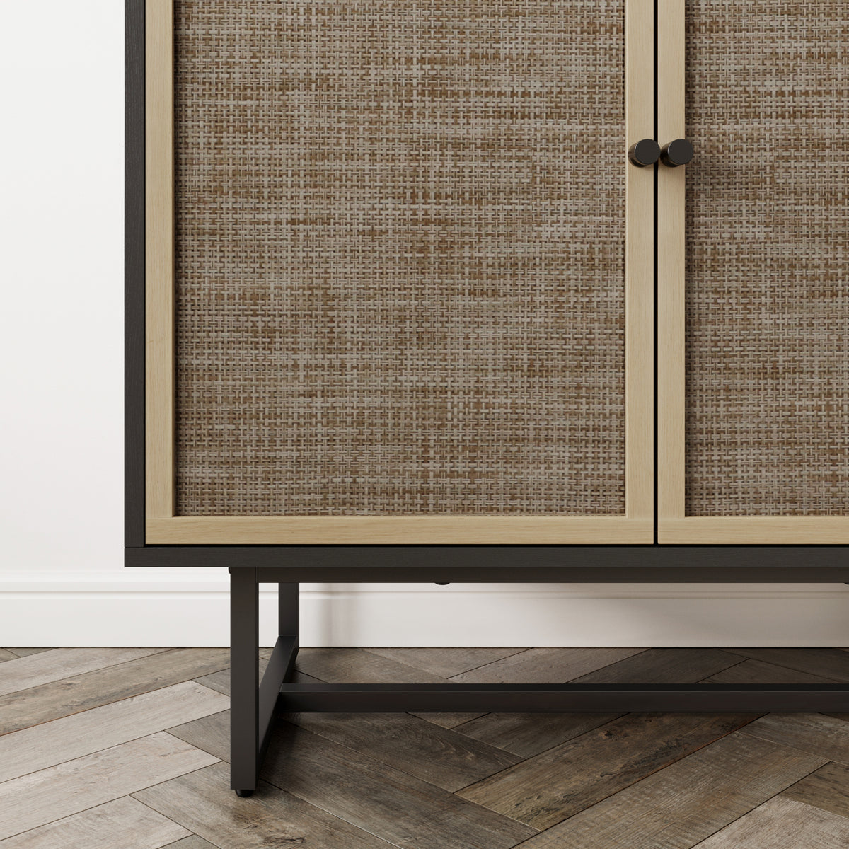 A wooden cabinet with two doors featuring a textured brown woven inlay and small dark circular knobs, set on a dark metal base.