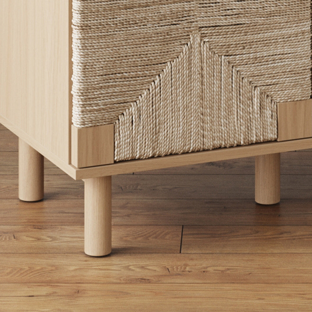 Light wood cabinet with woven rope panels on short cylindrical legs.