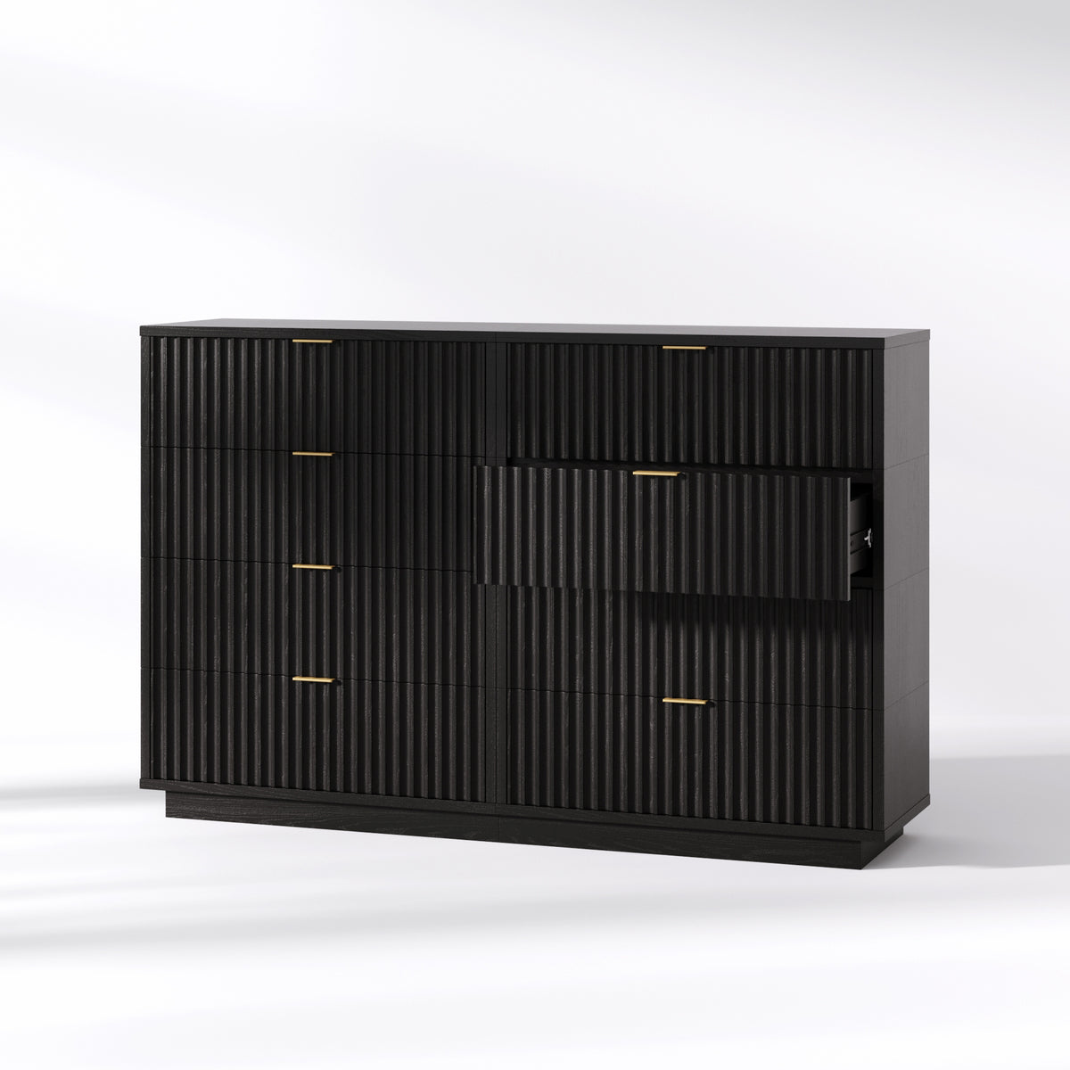 Black wooden dresser with fluted drawer fronts, thin gold handles, and one drawer pulled open.