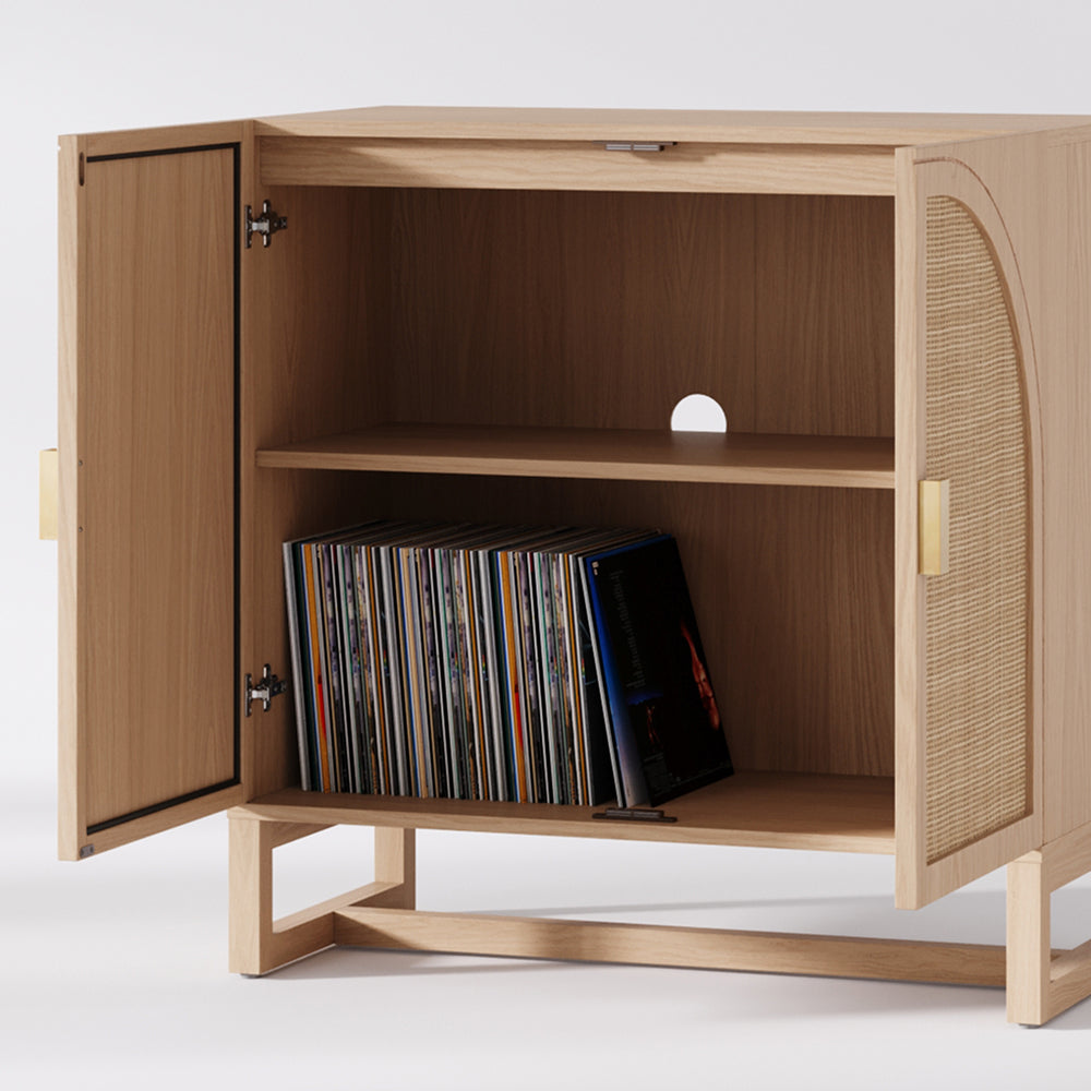Light wood cabinet with two open doors revealing a storage shelf holding a collection of vinyl records.
