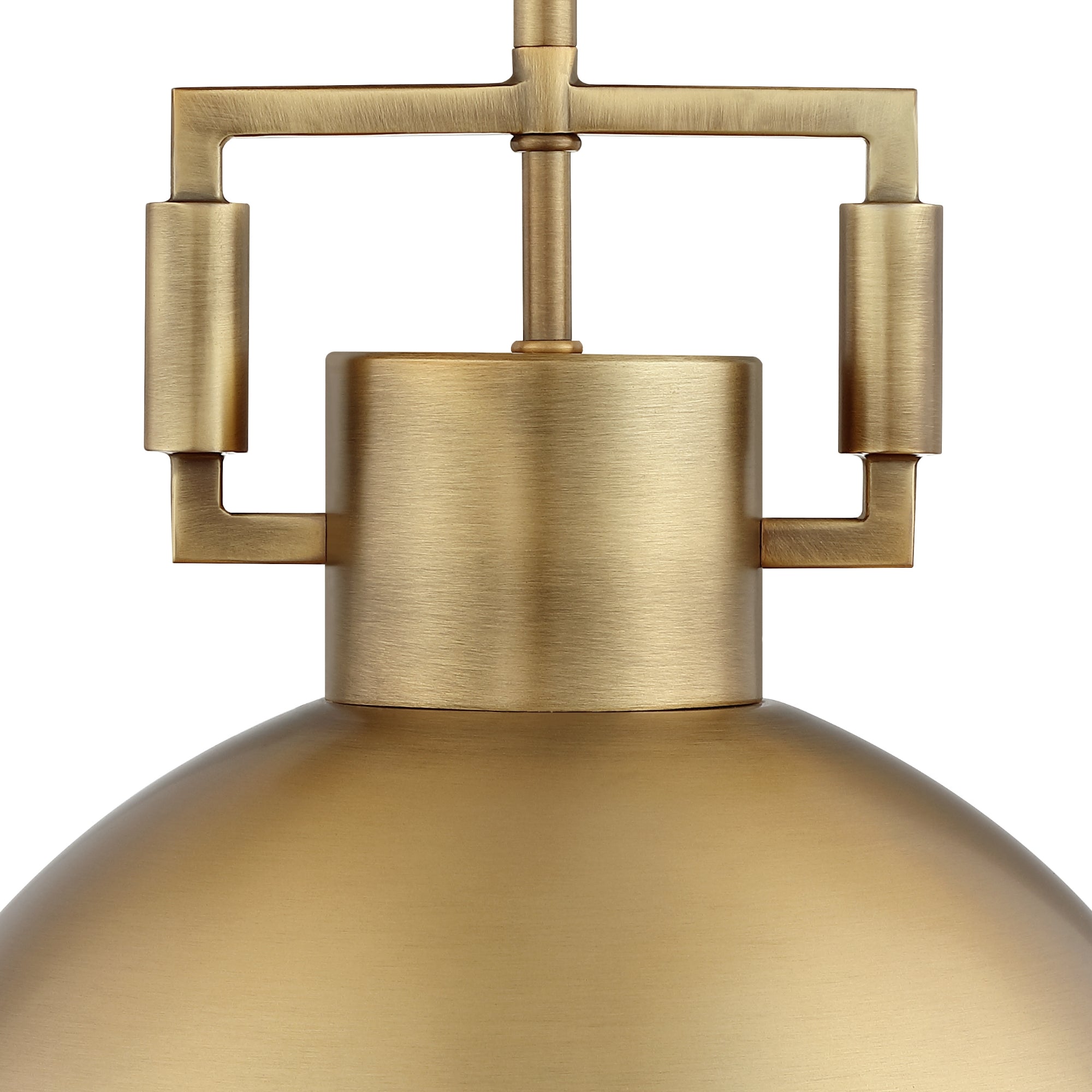 Close-up of a modern pendant light fixture with a brushed brass finish, featuring geometric metal details and a smooth, dome-shaped shade against a white background.