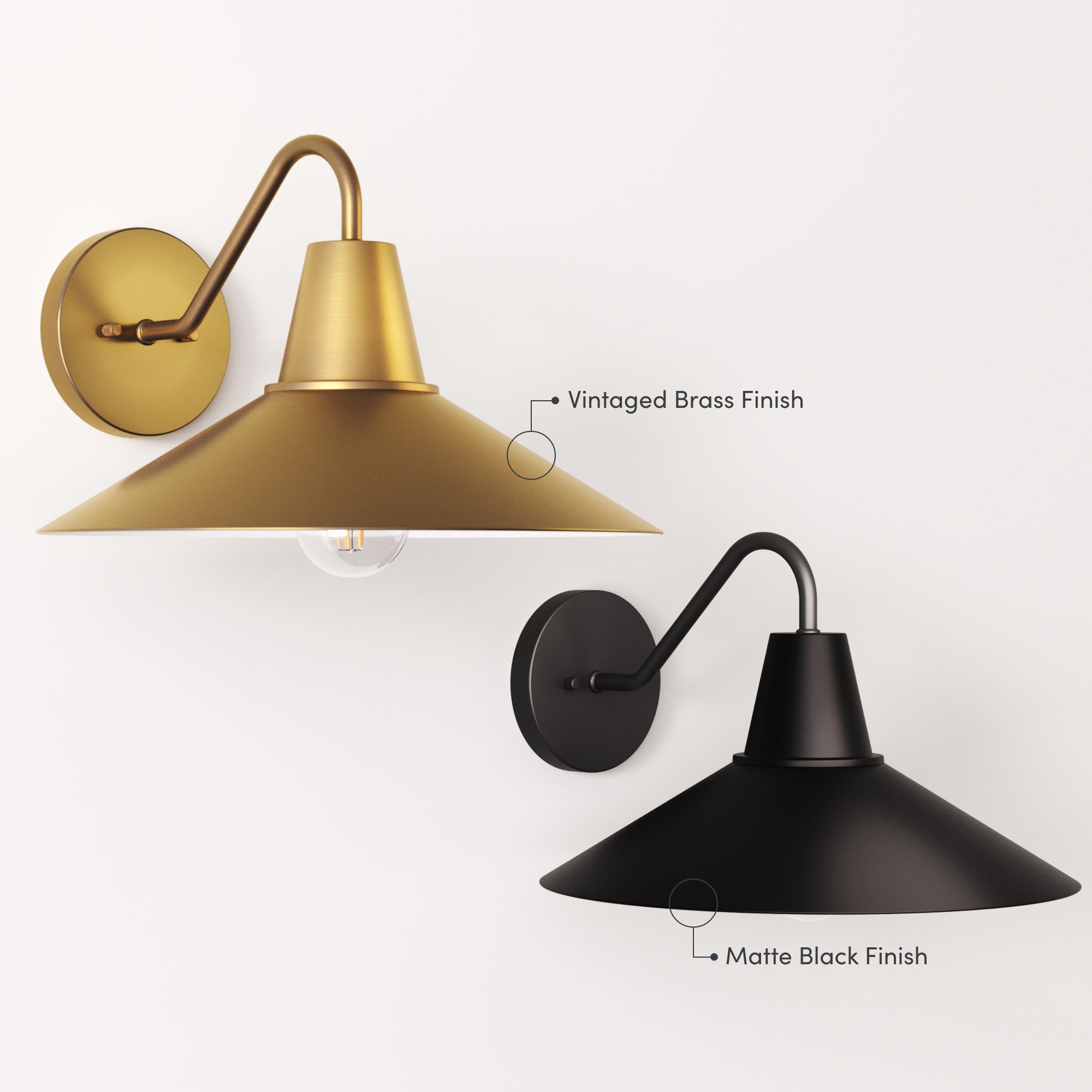 Two wall-mounted sconces with wide, conical shades: one in a vintaged brass finish above, and one in a matte black finish below, both with curved arms and round wall plates against a white background.