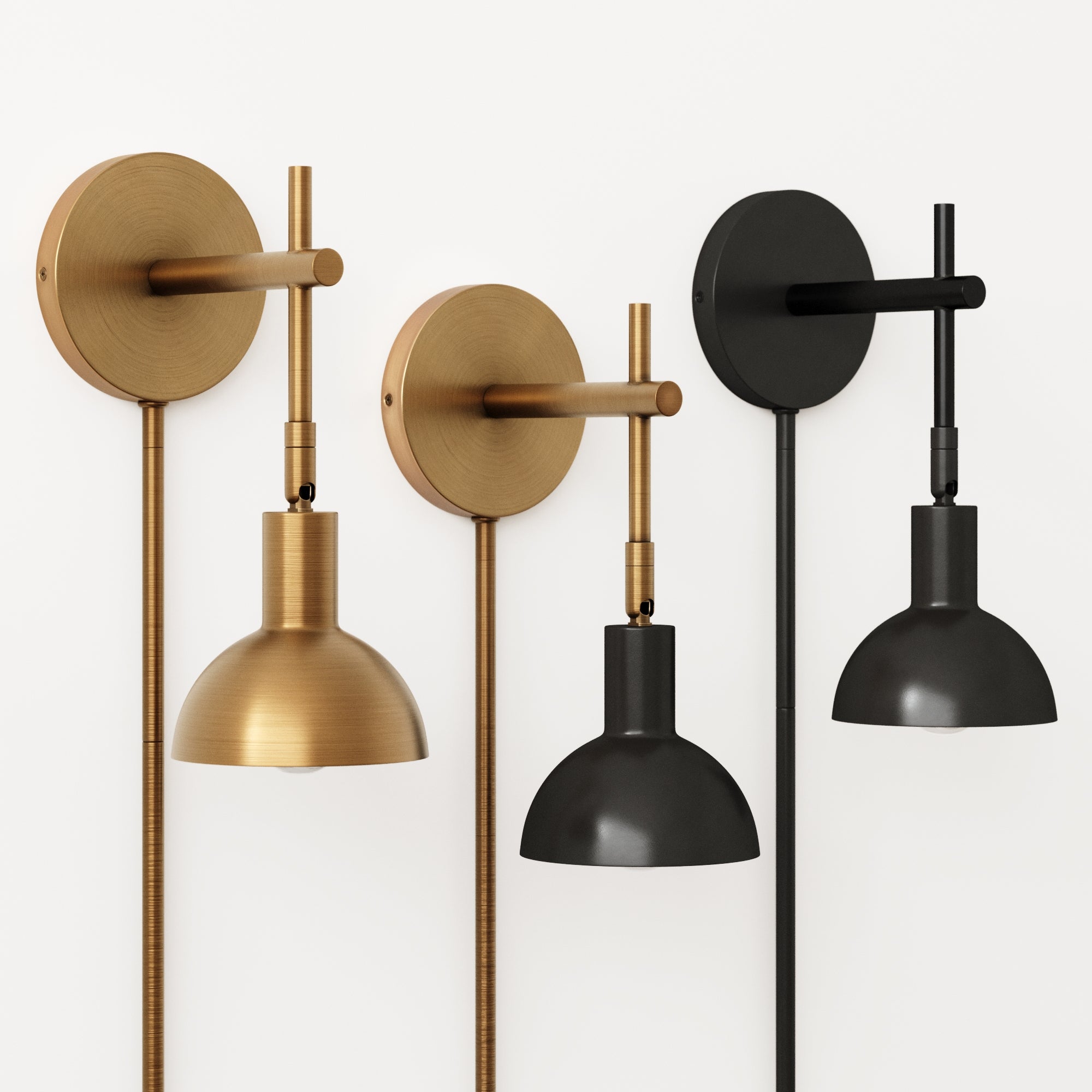 Four modern wall-mounted sconces are shown in a row against a white background; two are brass with dome-shaped shades, and two are matte black with matching shades, all with visible cords.
