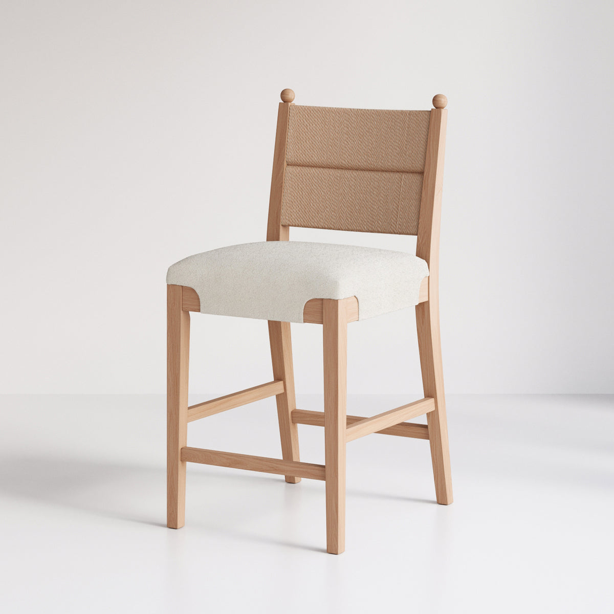 Wooden counter stool with a woven backrest and an upholstered seat.
