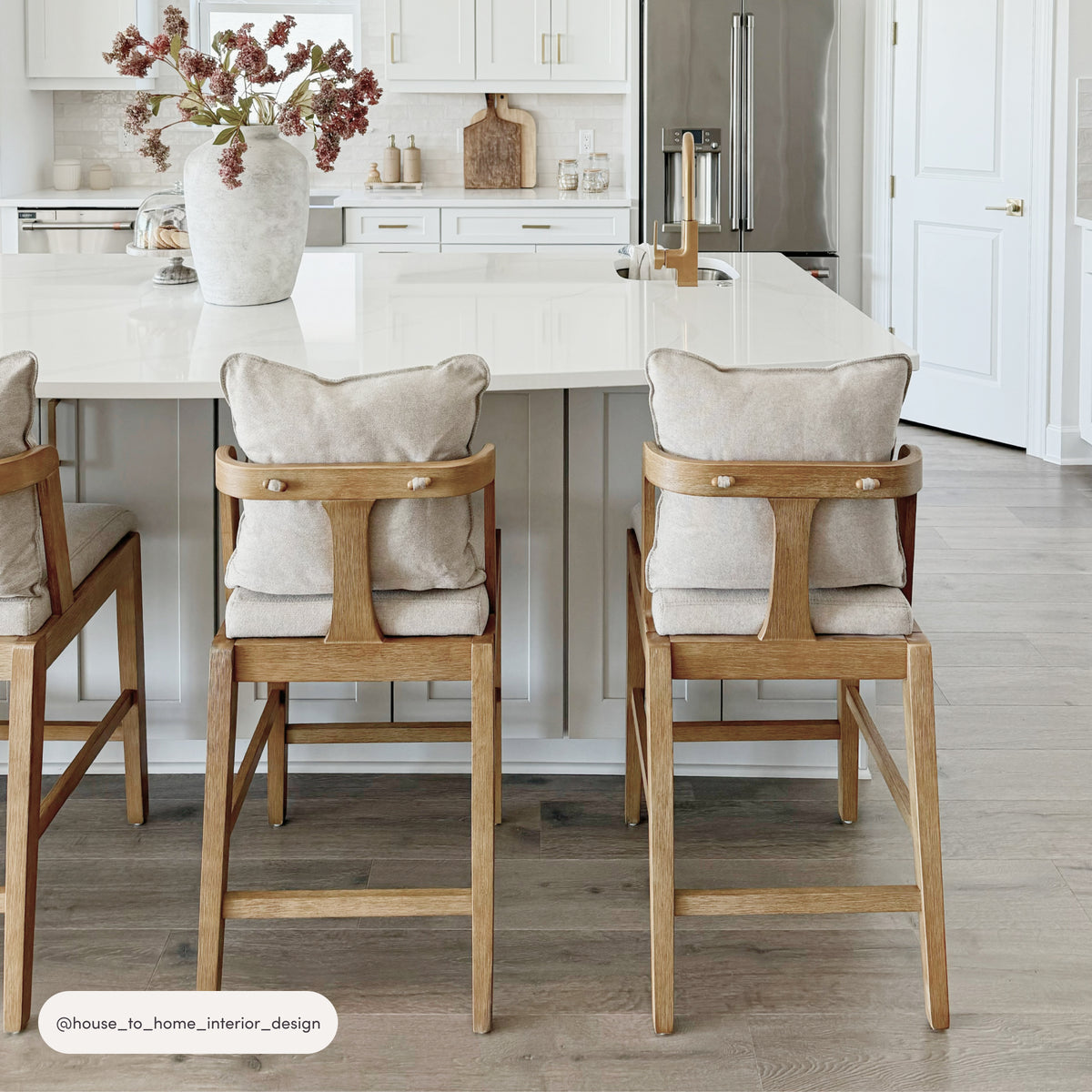 Two Scandinavian 2-Pack Bar Stool with Back Light Brown stools with upholstered seat cushions and backrests positioned at a kitchen island.