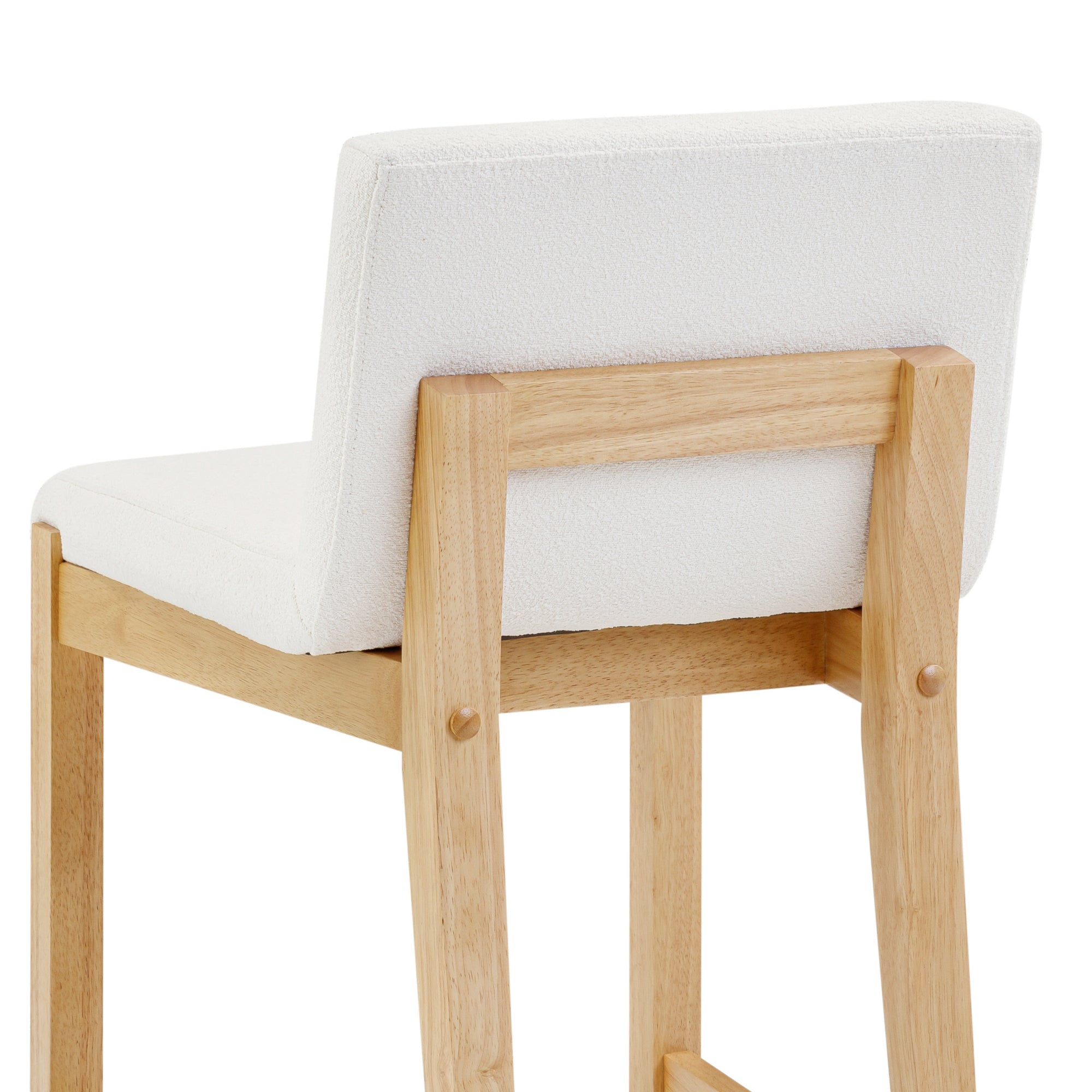 A modern bar stool with a light wood frame and white cushioned seat and backrest, shown from the back at an angle.