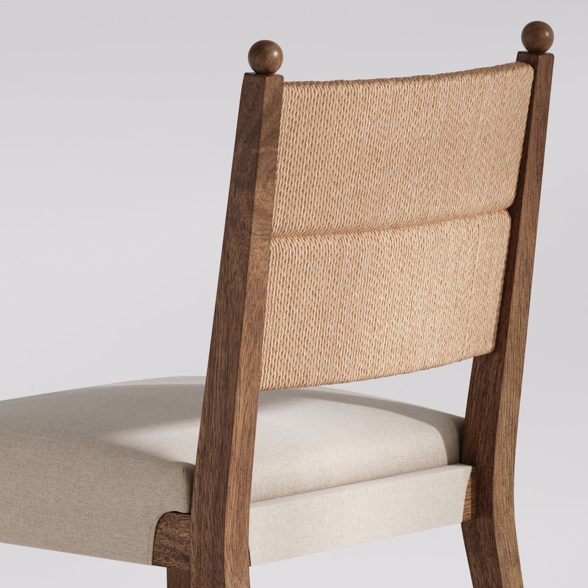 Wooden chair with a woven rope backrest and an upholstered seat.