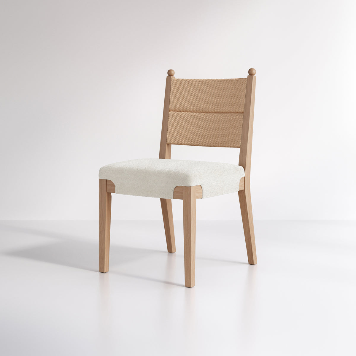A wooden dining chair with a woven backrest and an upholstered seat.