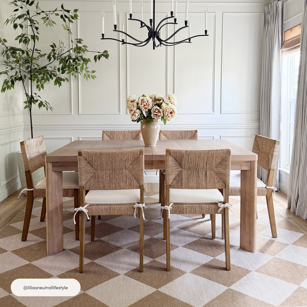 Nathan James Boucle & Seagrass Dining Chair Light Brown set of six with seagrass backrests and off-white boucle cushions, arranged in a paneled dining room.
