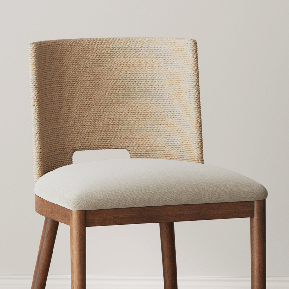 Dining chair with a wood frame, a light-colored upholstered seat, and a curved backrest wrapped in beige rope.