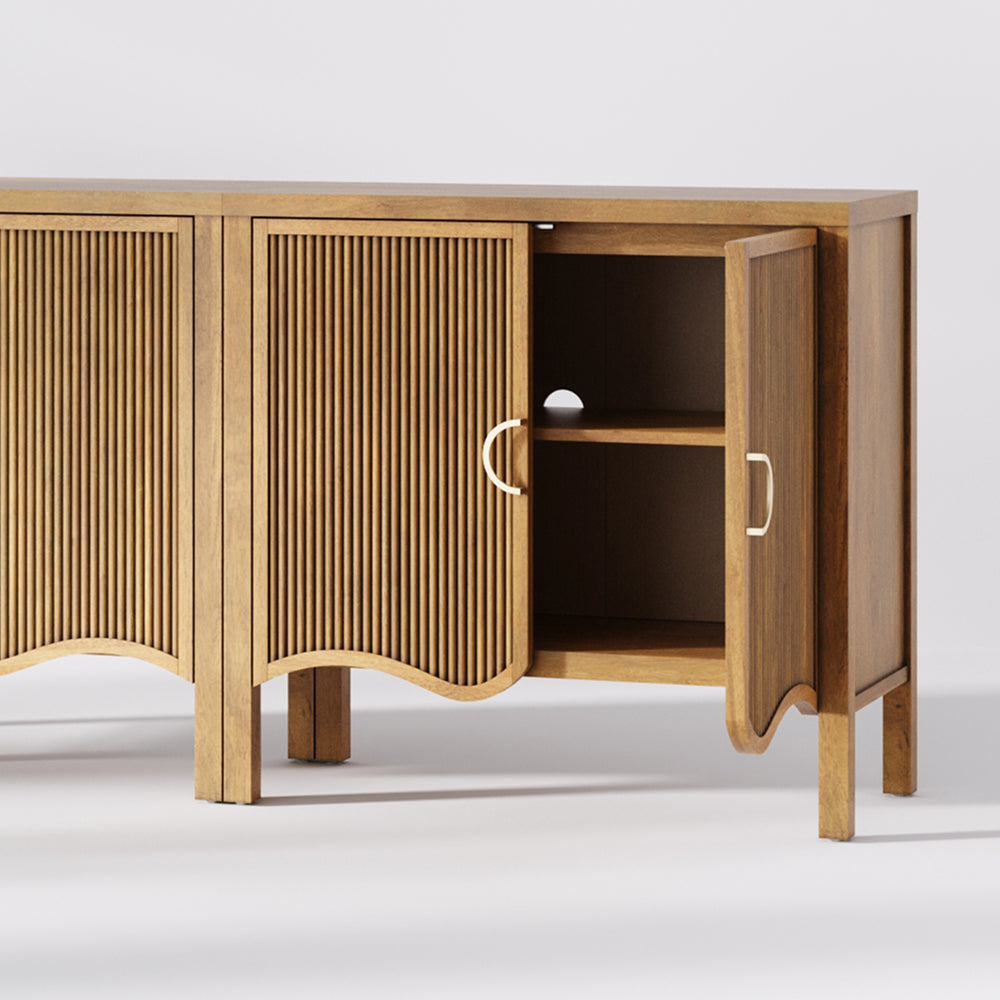 Wooden sideboard with fluted cabinet doors, arched base cutouts, and one door partially open to show an interior shelf.