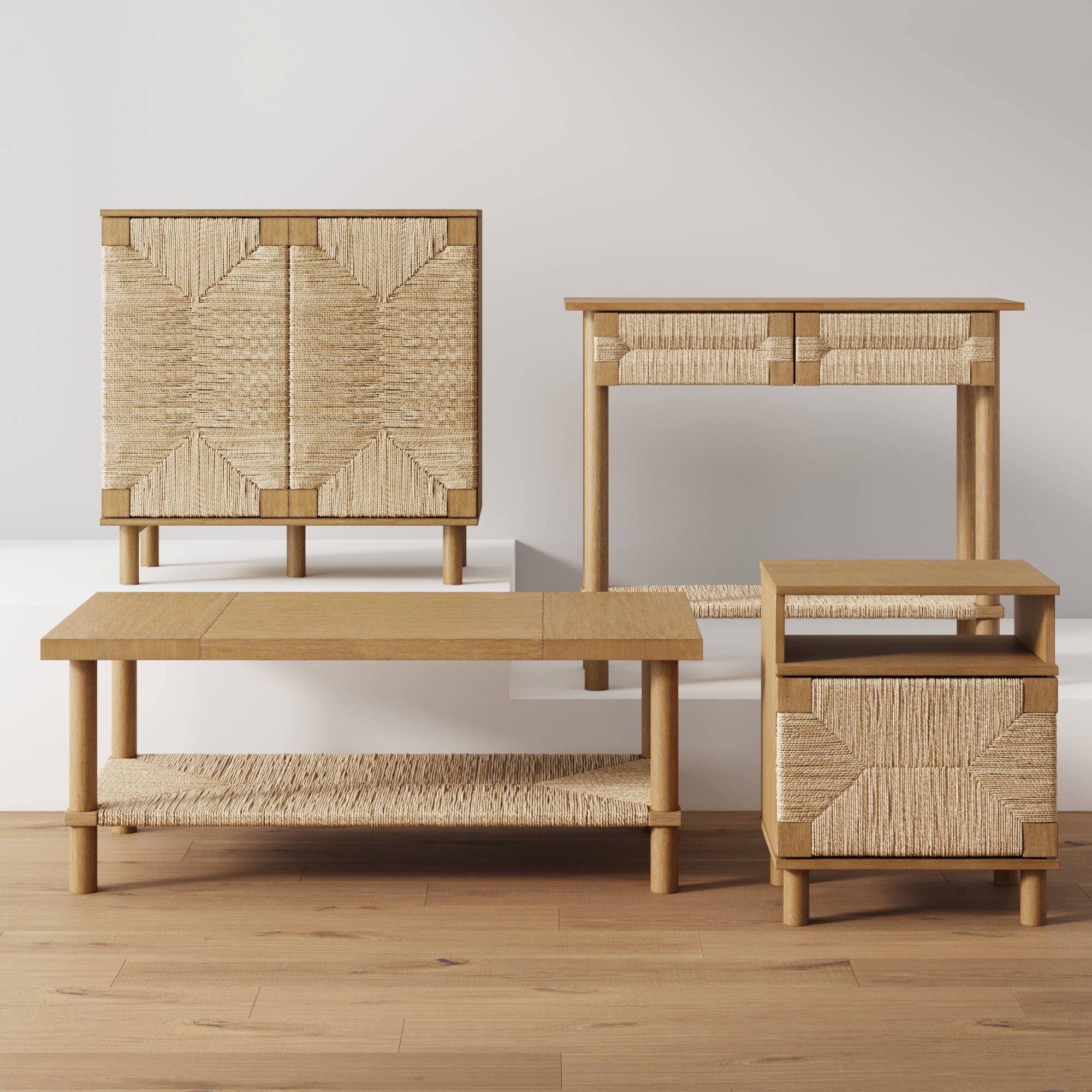 Four pieces of light wood furniture with woven straw accents are displayed on a wooden floor: a cabinet, a console table, a coffee table, and a side table, all against a plain white background.