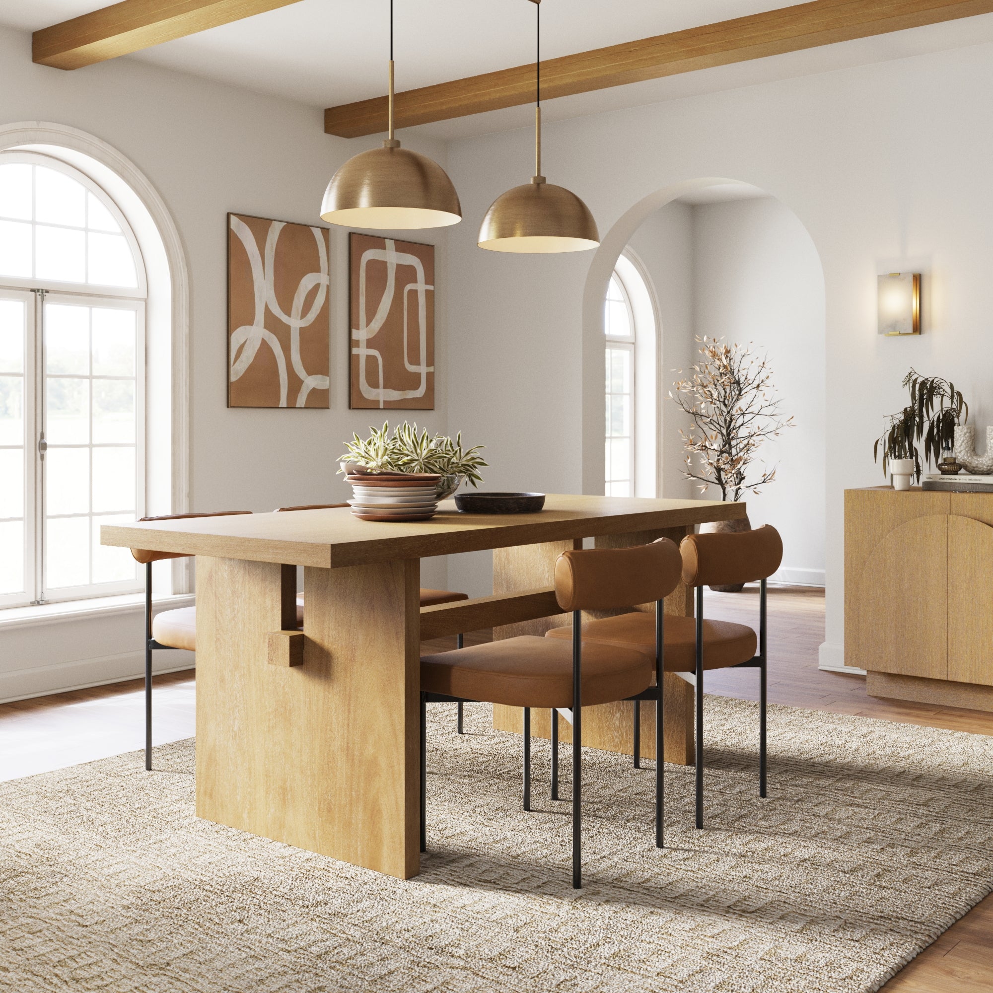 A modern dining room with a wooden table, four tan chairs, pendant lights, a large window, abstract wall art, and a plant centerpiece on a textured rug. Neutral tones create a warm and inviting atmosphere.