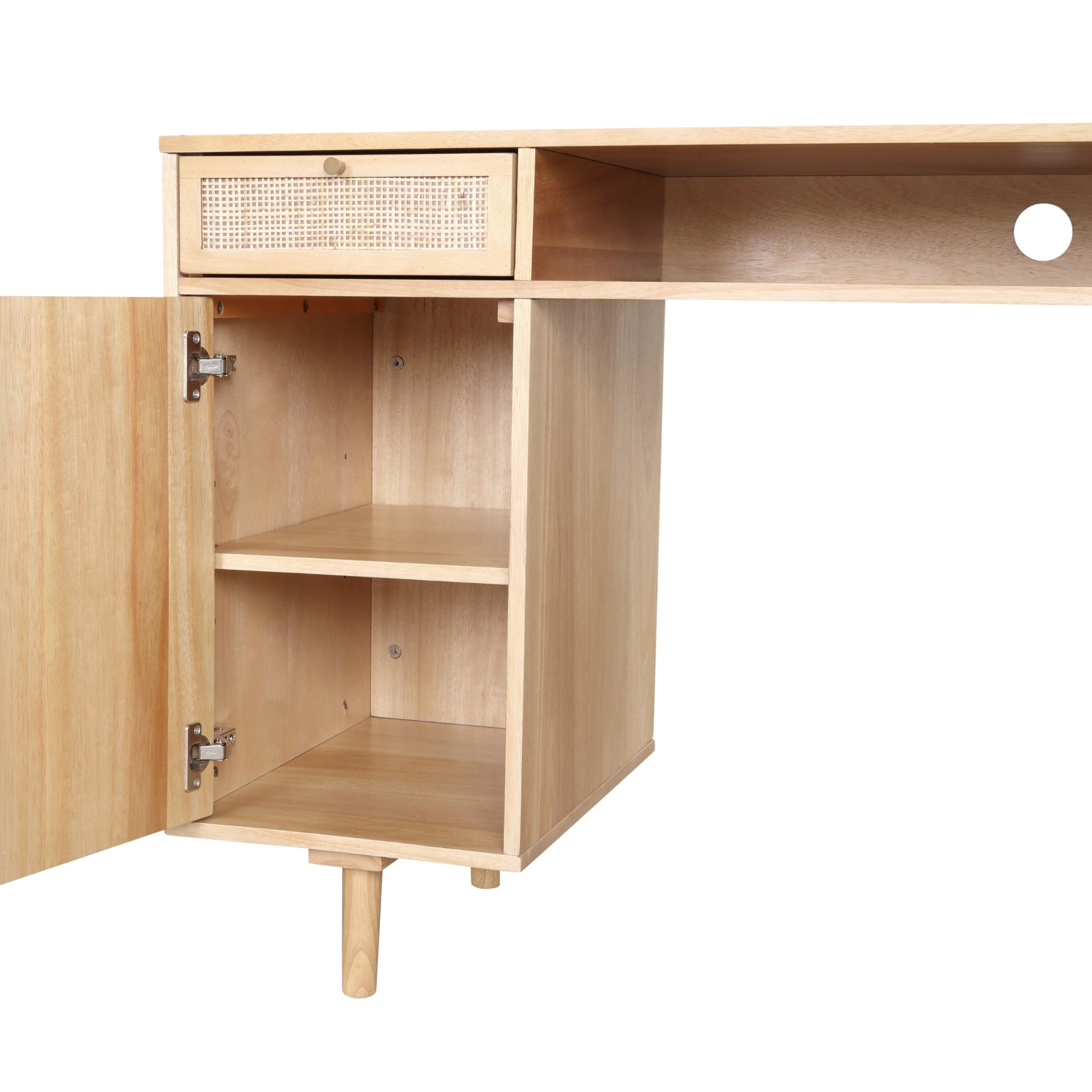 A light wood desk features an open cabinet with a shelf and a hinged door. Above the cabinet is a small drawer with a woven rattan front. The desk has clean, simple lines and one visible leg for support.