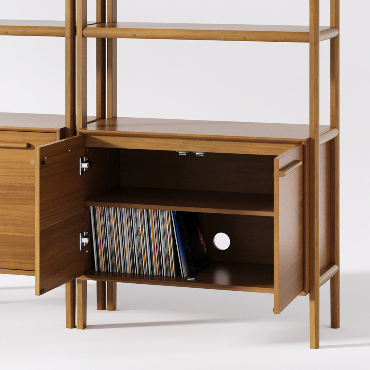 Wooden shelving unit with open cabinet doors revealing a shelf containing a collection of vinyl records.