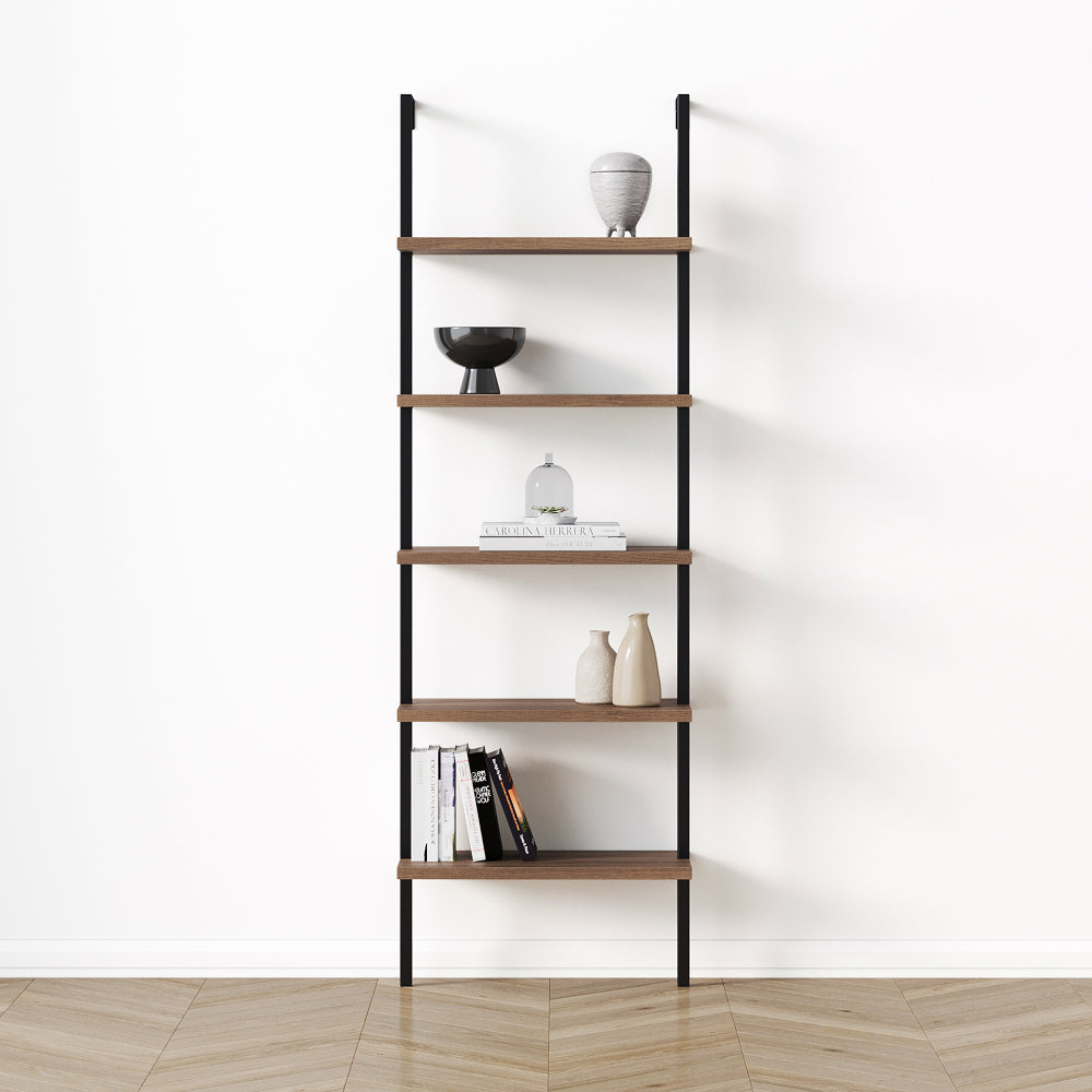 A five-tier ladder shelf with black metal supports and wooden shelves, styled with books and decorative vases against a white wall.