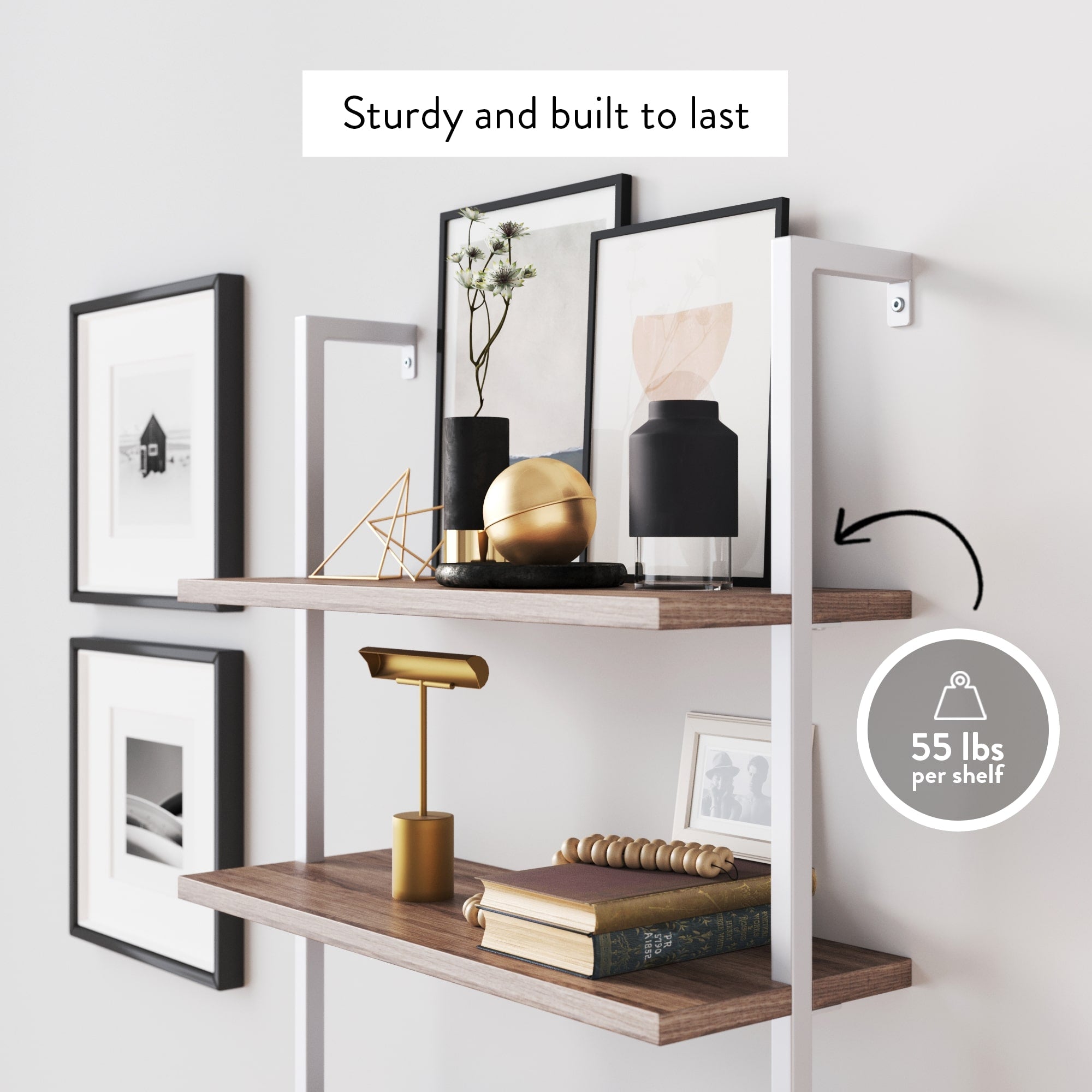 Two wood and metal wall shelves hold books, decor, and framed art. A label reads Sturdy and built to last, and an icon shows each shelf supports up to 55 lbs. Minimalist decor is arranged on and around the shelves.