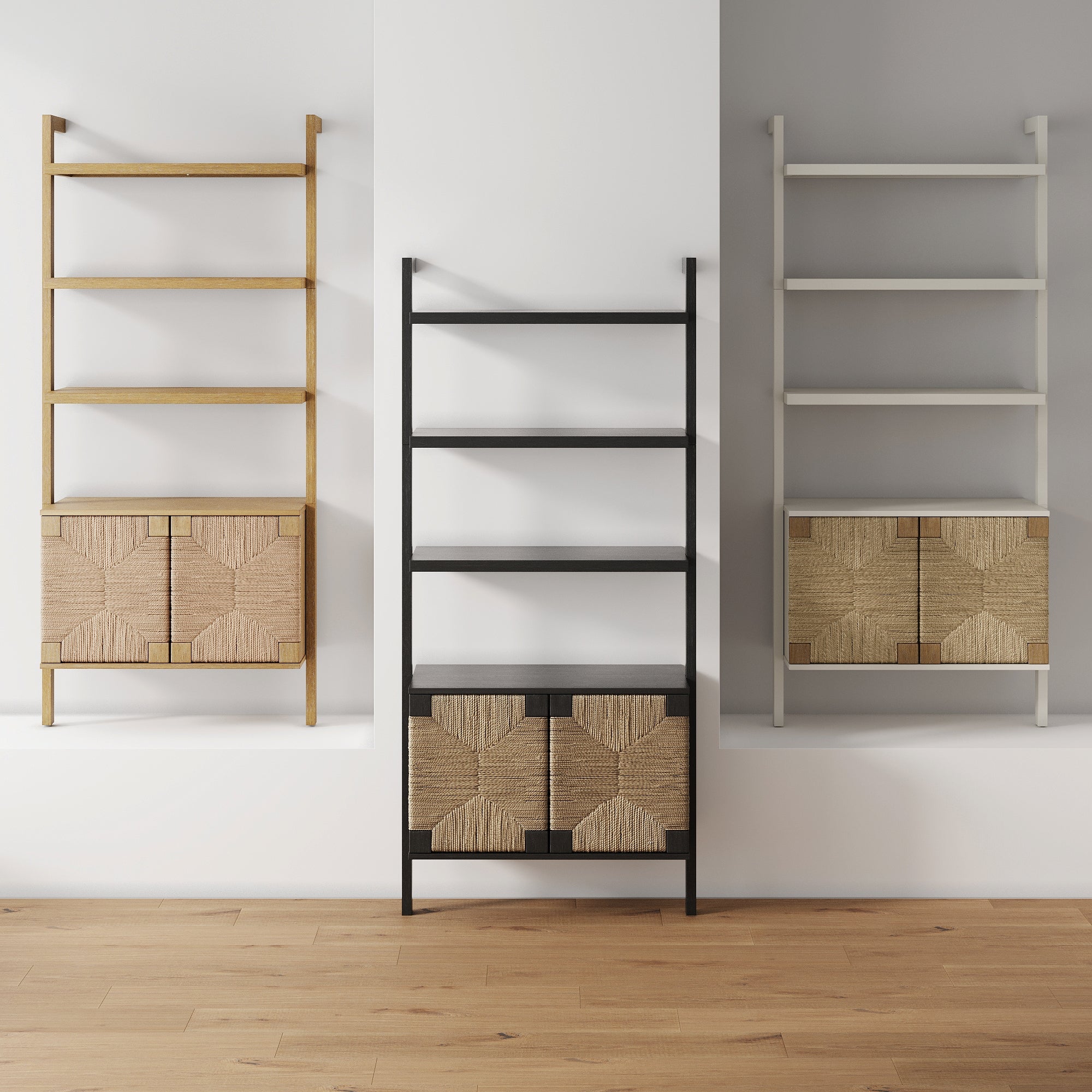 Three modern shelving units with woven cabinet doors are mounted on a wall. The units are in wood, black, and white finishes, standing side by side on a light wooden floor.