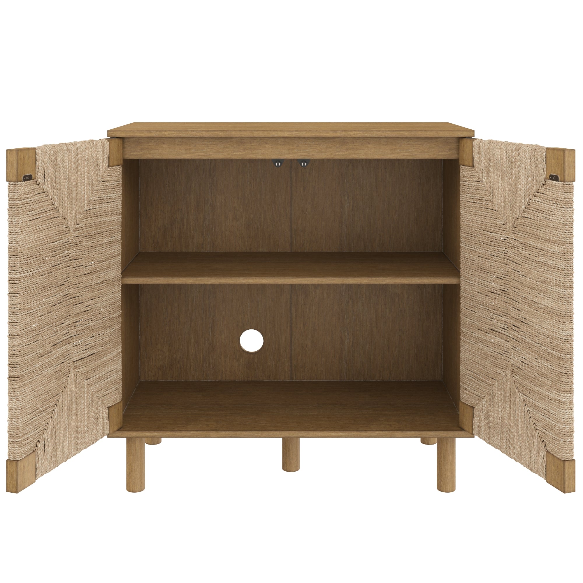 A wooden cabinet with two woven doors open, revealing two shelves inside and a circular cable management hole in the back panel. The cabinet has four cylindrical legs.