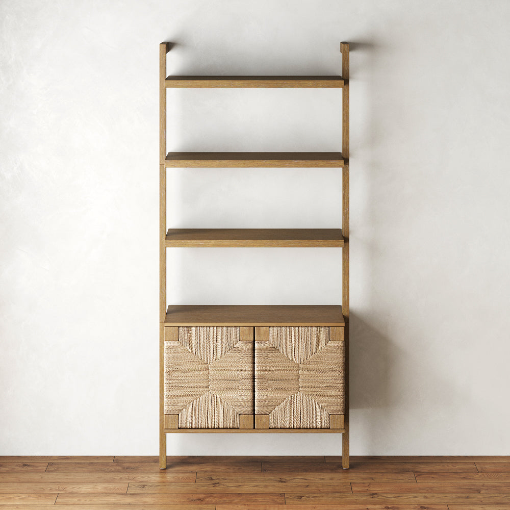 Tall wooden shelving unit with three open shelves above a cabinet featuring two doors with woven detailing.