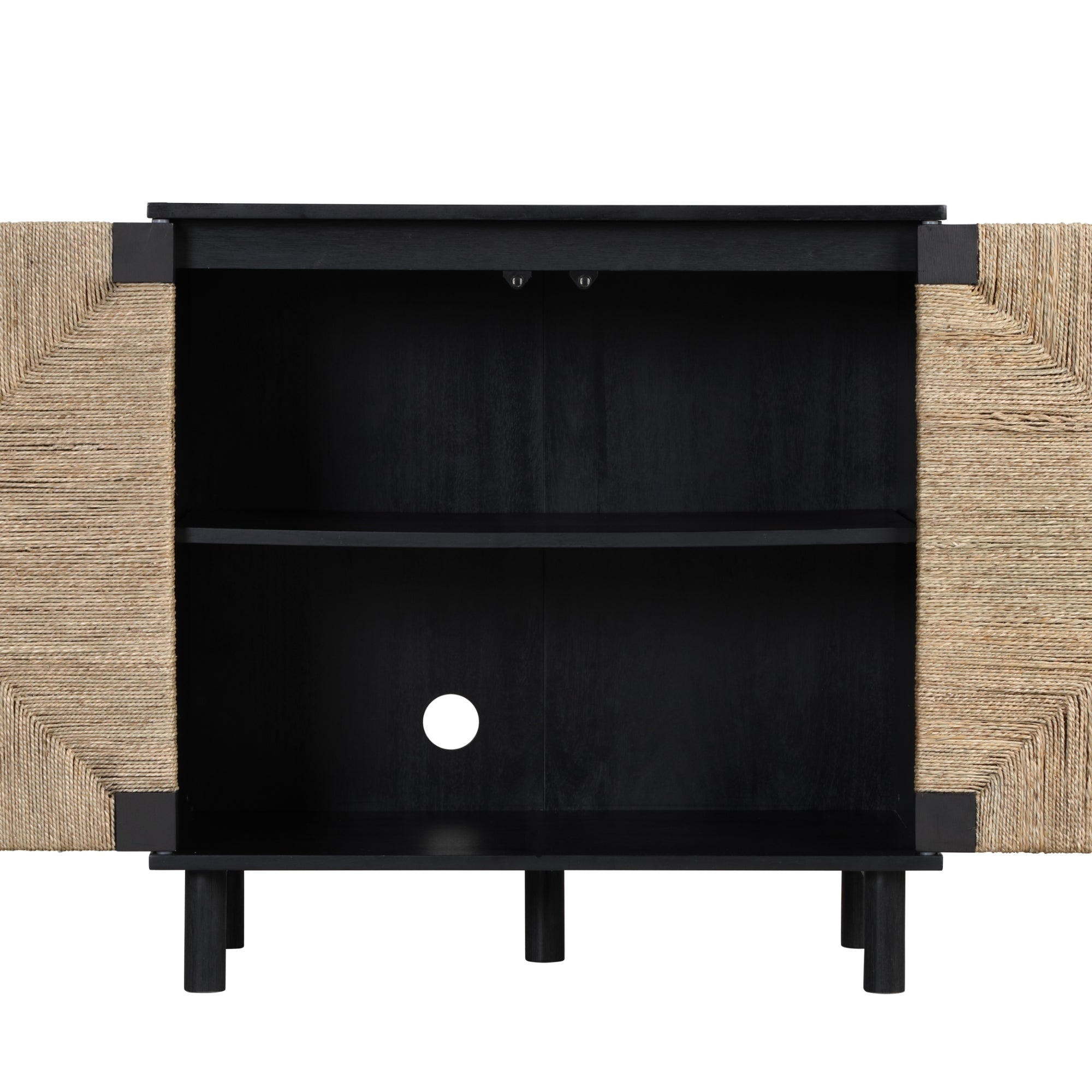 A modern cabinet with natural woven doors open to reveal a black interior, one shelf, a circular cable hole in the back, and short black legs.