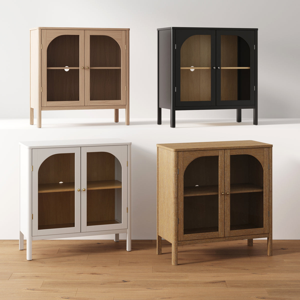Four Curio Cabinet Credenza with Glass Door Black transitional style arched-door cabinets in light wood, black, white, and medium wood finishes, displayed on a tiered platform with brass finish hardware.