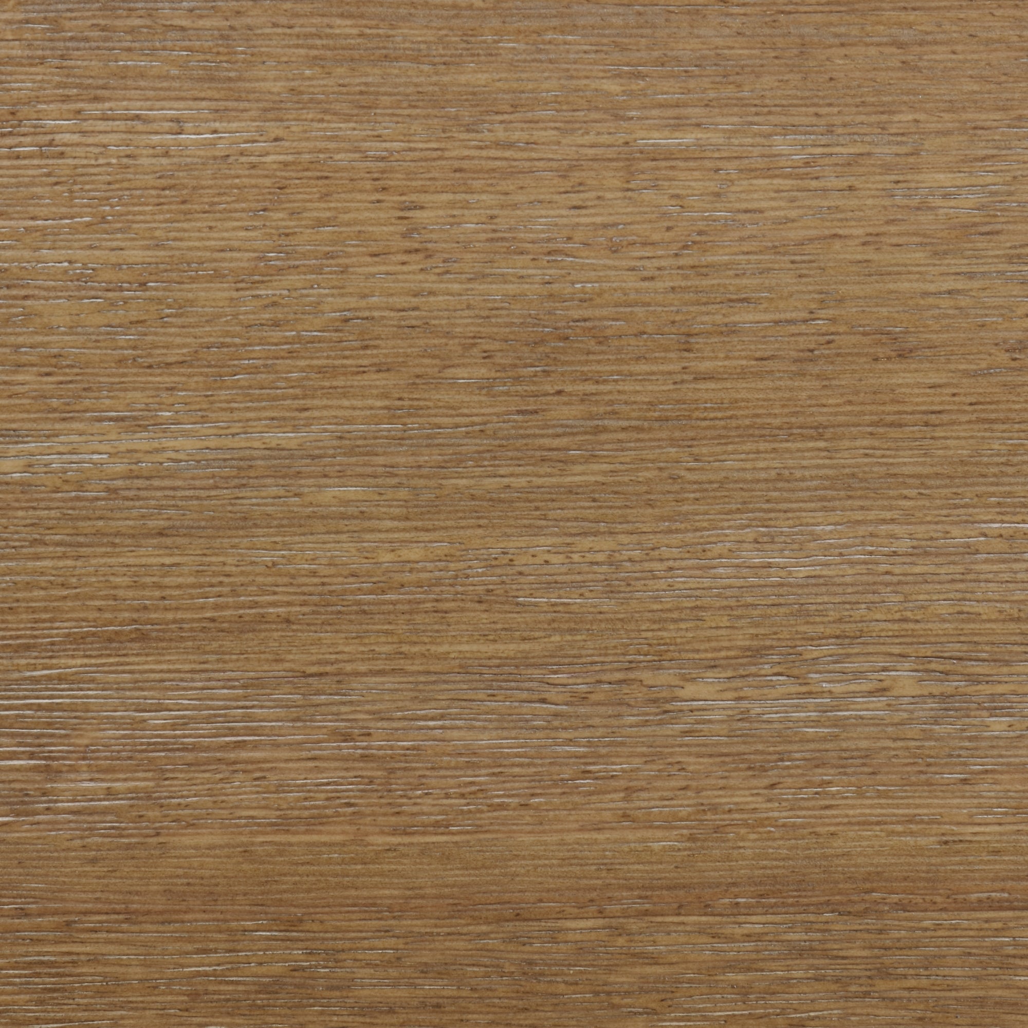 Close-up of a light brown wooden surface with a visible natural grain pattern running horizontally, showing subtle texture and small variations in color.