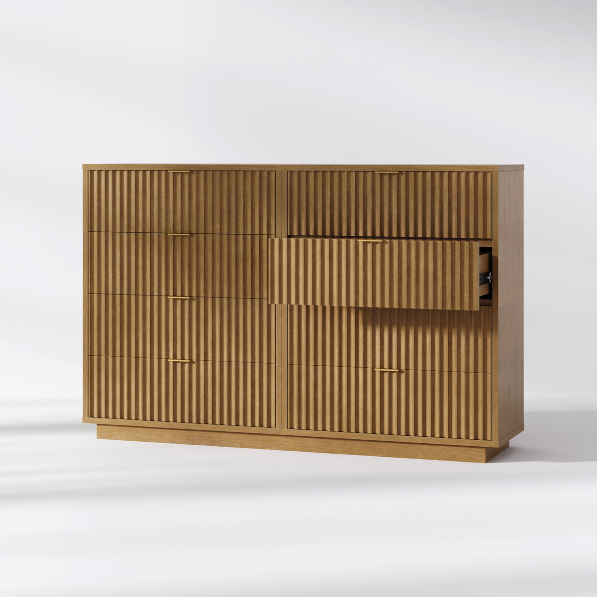 A six-drawer wooden dresser with a fluted facade, brass hardware, and one drawer pulled open.