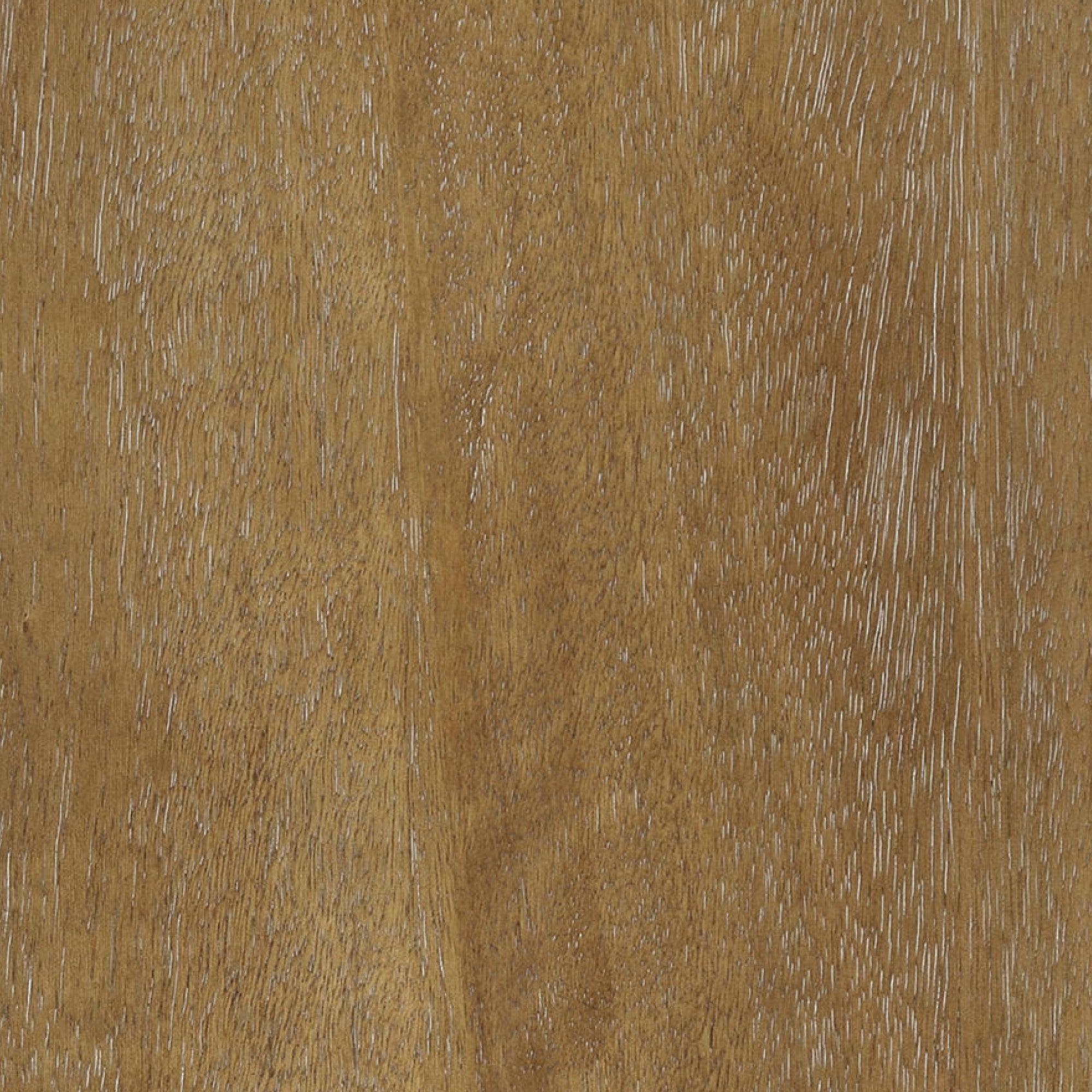 Close-up of a wooden surface with a light brown color, visible natural grain patterns, and a slightly textured appearance. The wood shows variations in tone and subtle streaks throughout.