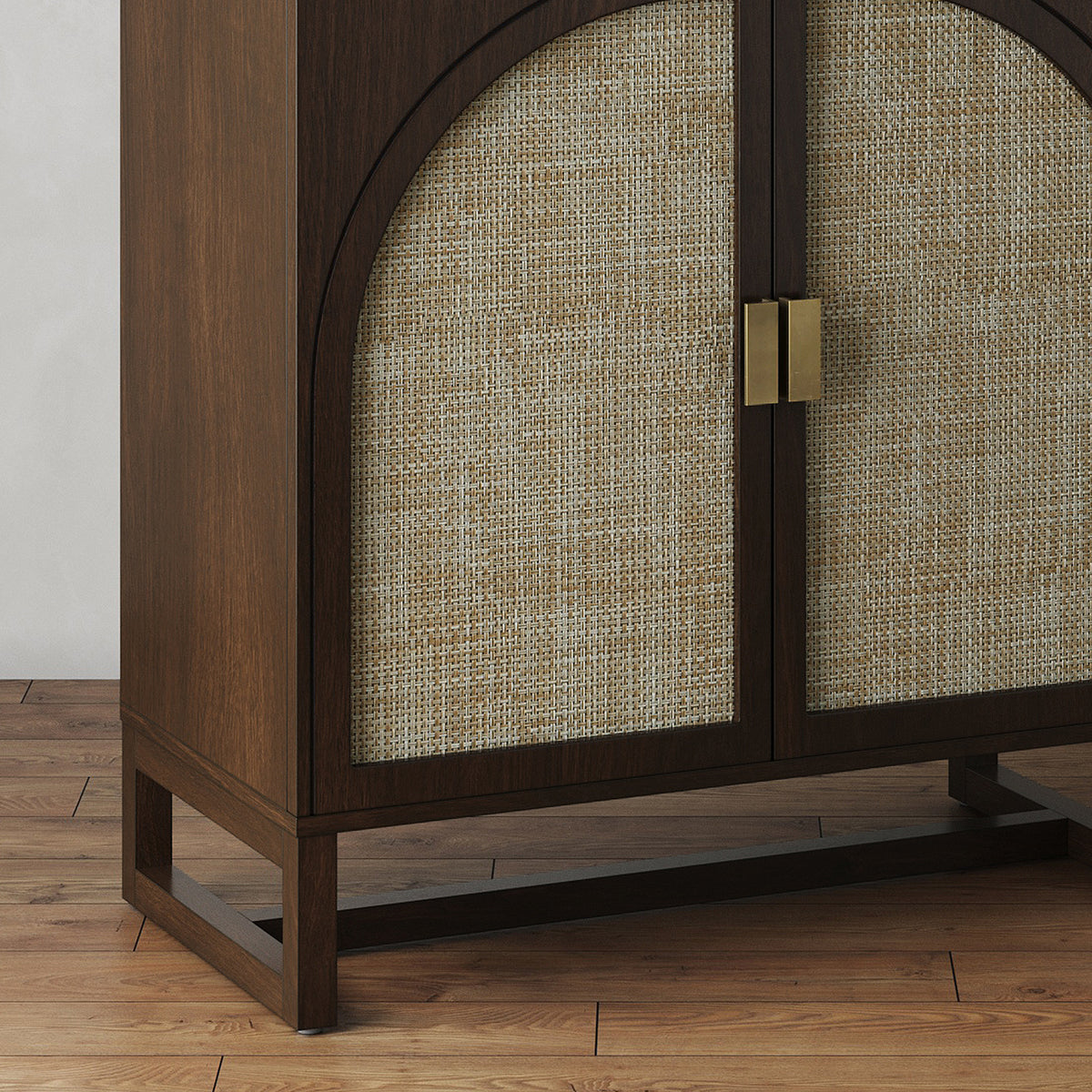 Dark wood cabinet with arched rattan panels on the doors and rectangular brass pulls.