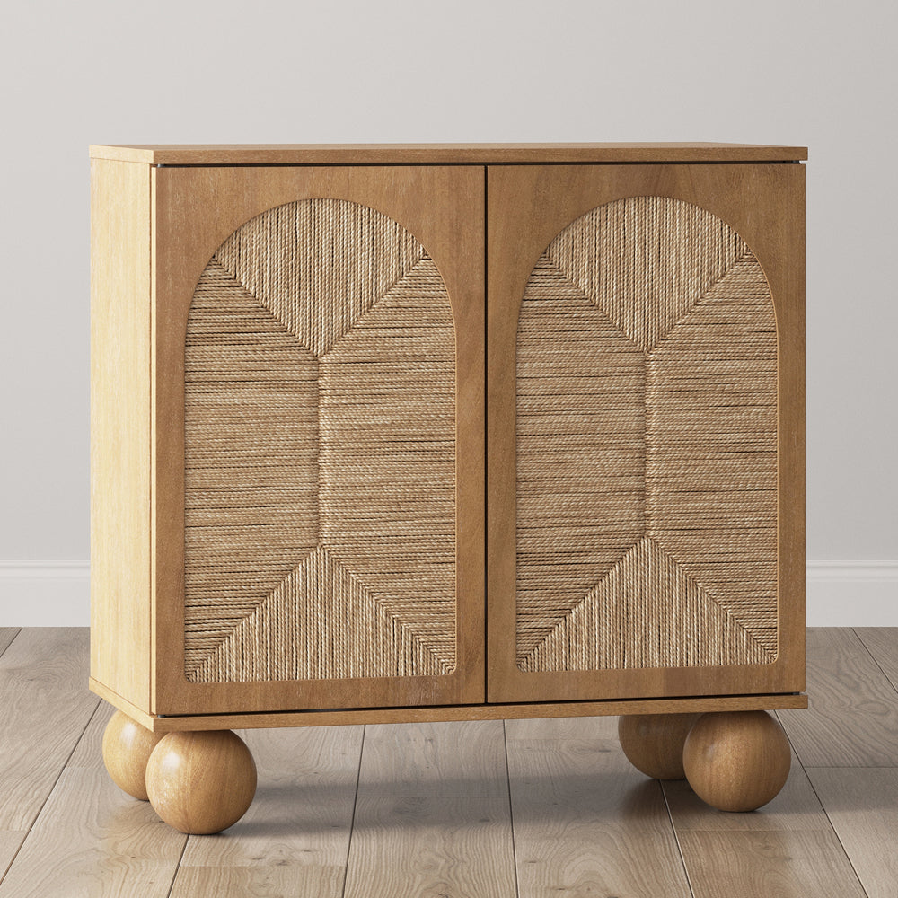 Two-door wooden cabinet with arched rope-textured door panels and four large spherical feet.