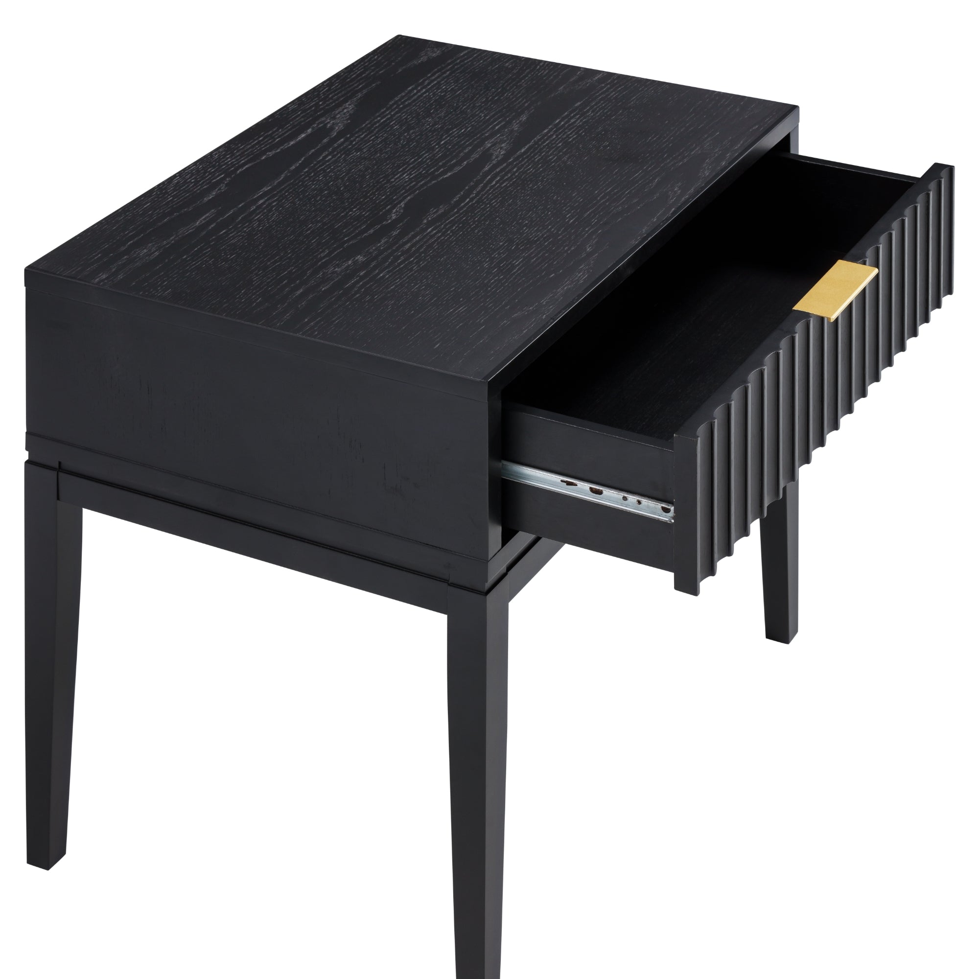 A modern black wooden side table with four legs and a single drawer partially open, featuring a gold rectangular handle and vertical grooves on the drawer front.