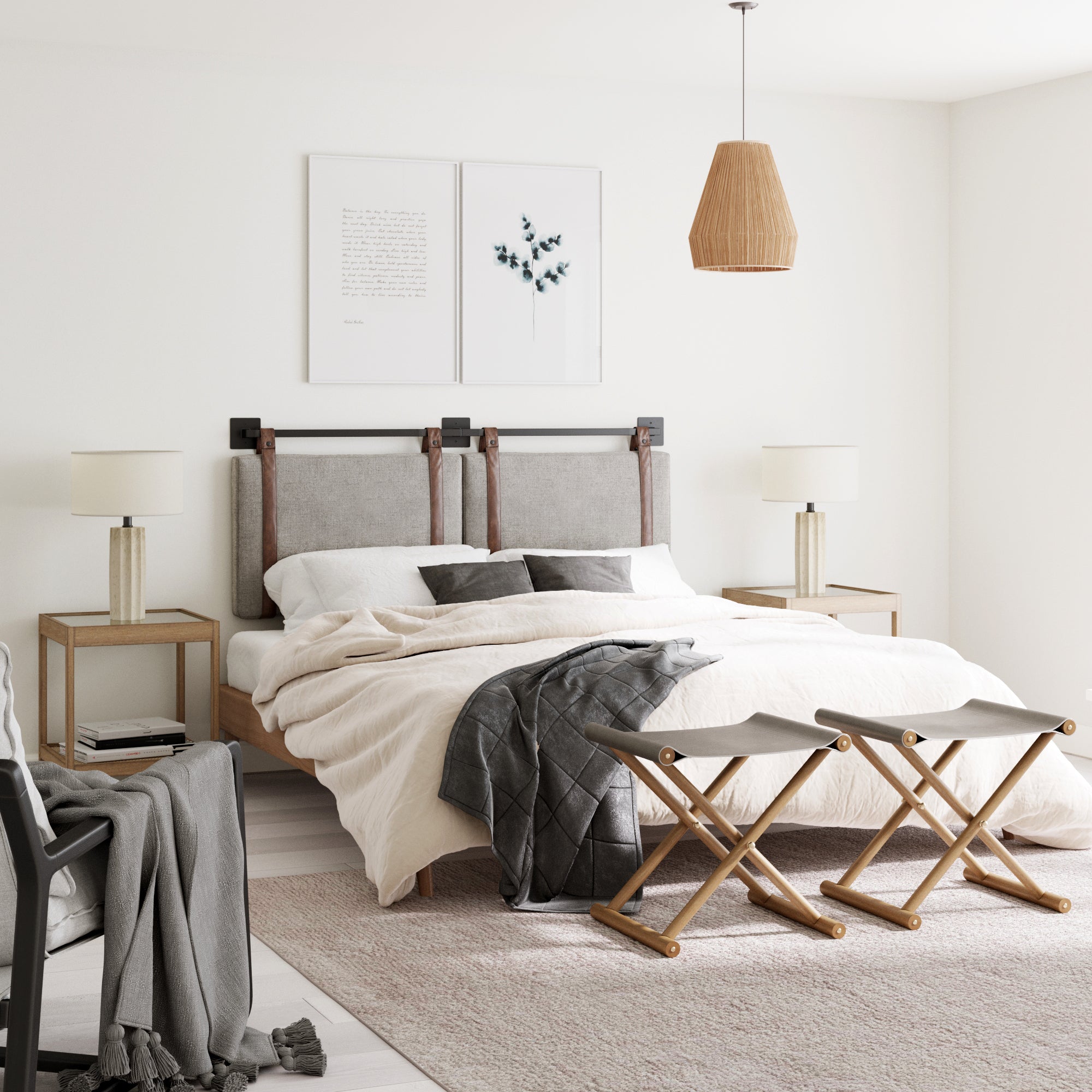 A modern bedroom with a neutral color palette, featuring a bed with a fabric headboard, light bedding, two bedside tables with lamps, two folding benches at the foot of the bed, and wall art above the headboard.