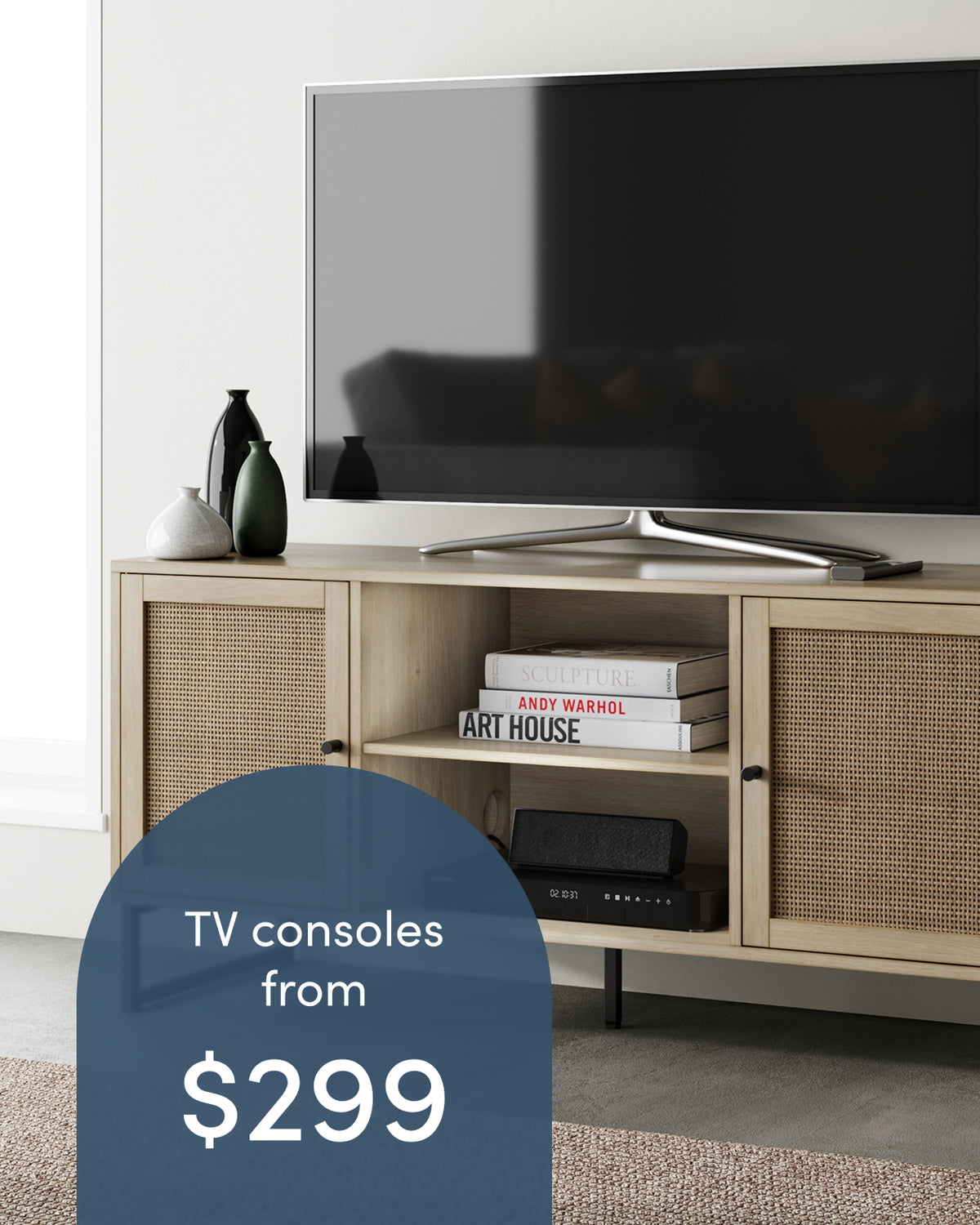 Light wood TV console with cane-patterned cabinet doors and an open center shelf, holding a television and several books, with text overlay reading TV consoles from $299.