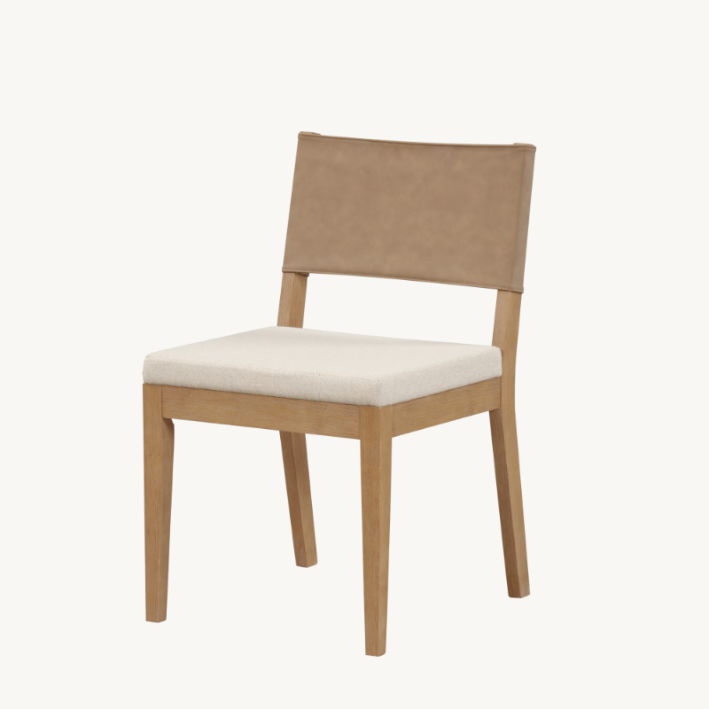 Light wood dining chair with an off-white upholstered seat and a tan leather backrest.